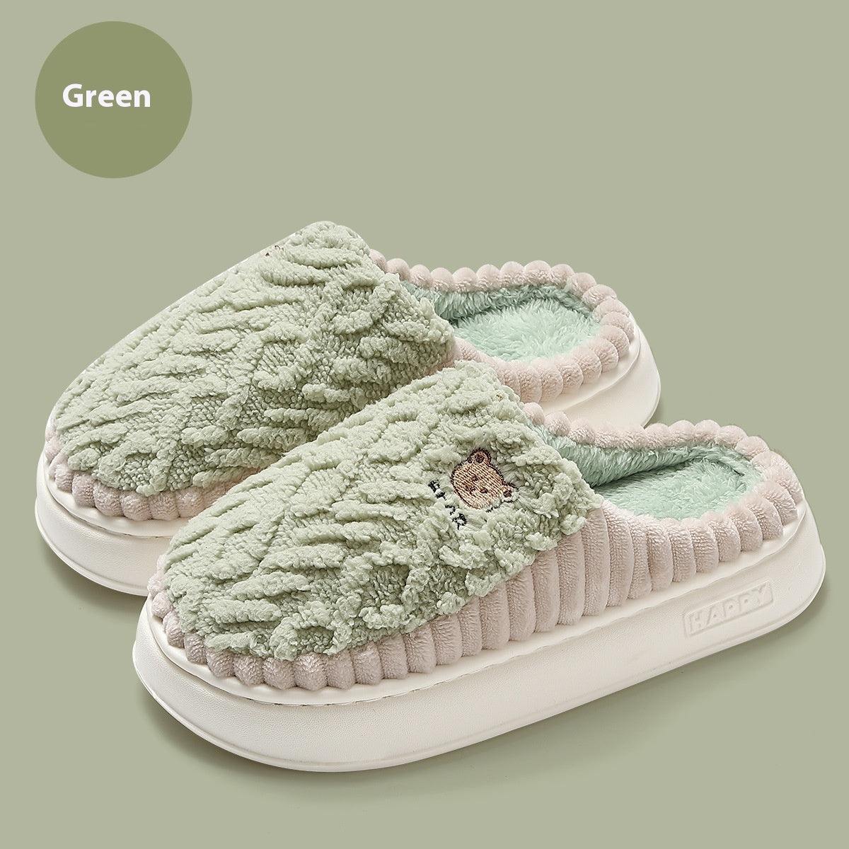 Cute bear plush slippers in green, warm fleece, non-slip soles for indoor use.