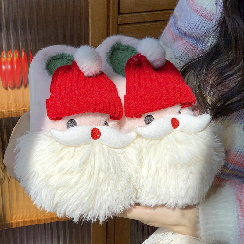 Cute Christmas Santa Claus home slippers with plush design for winter warmth.