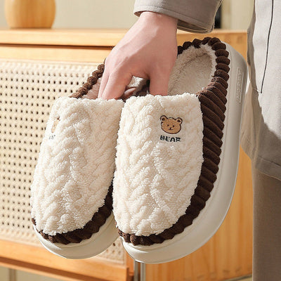 Cute bear plush slippers with warm fleece, non-slip PVC sole, neutral design for indoor use.