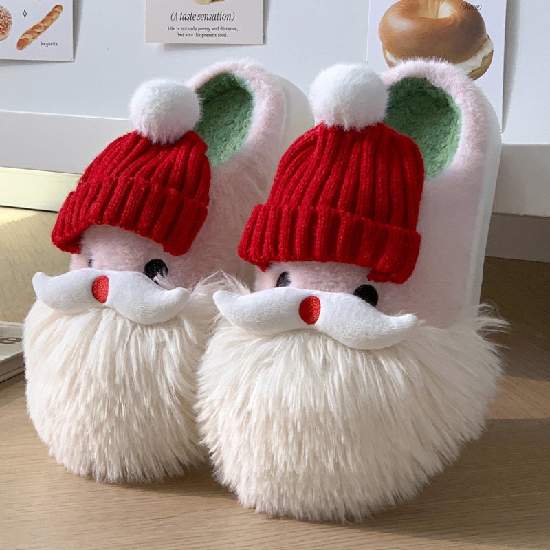 Cute Christmas Santa Claus indoor slippers with plush upper, red hat design, and cozy faux fur beard for winter warmth.