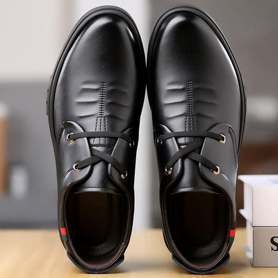 Black soft leather casual round toe shoes with lace-up design and low wedge heel.