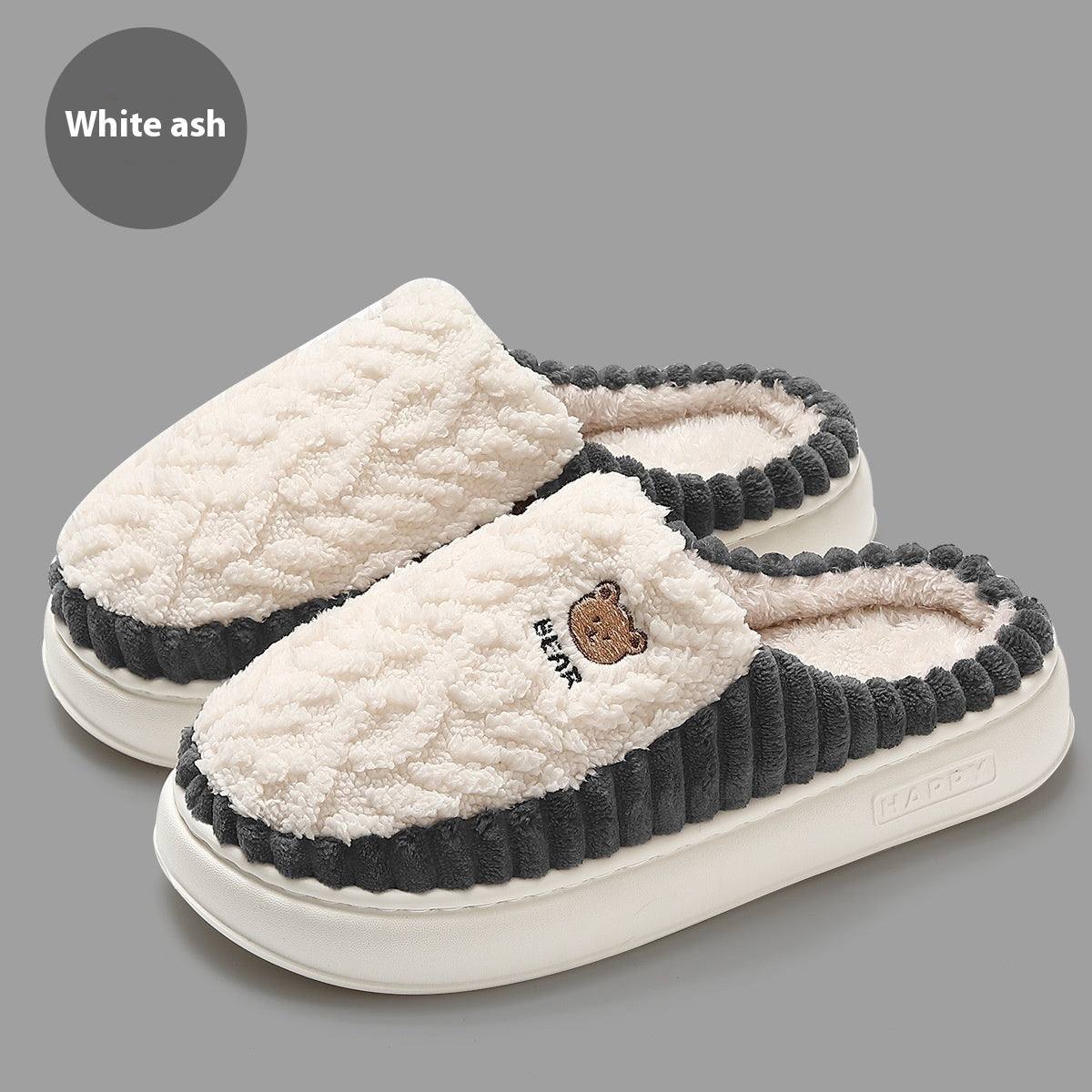 Cute bear plush slippers in white ash color with warm fleece and non-slip soles.