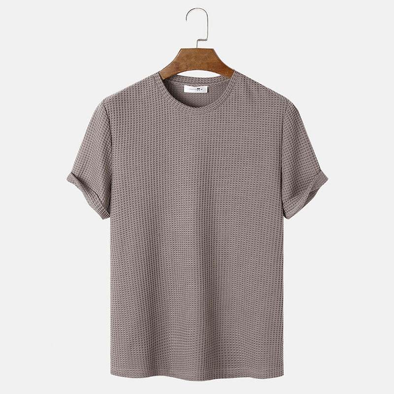 Men's summer solid color round neck T-shirt in brown on a hanger.