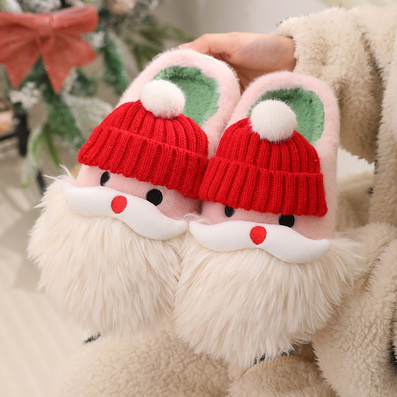 Cute Christmas Santa Claus home slippers with plush design and non-slip soles for winter warmth.